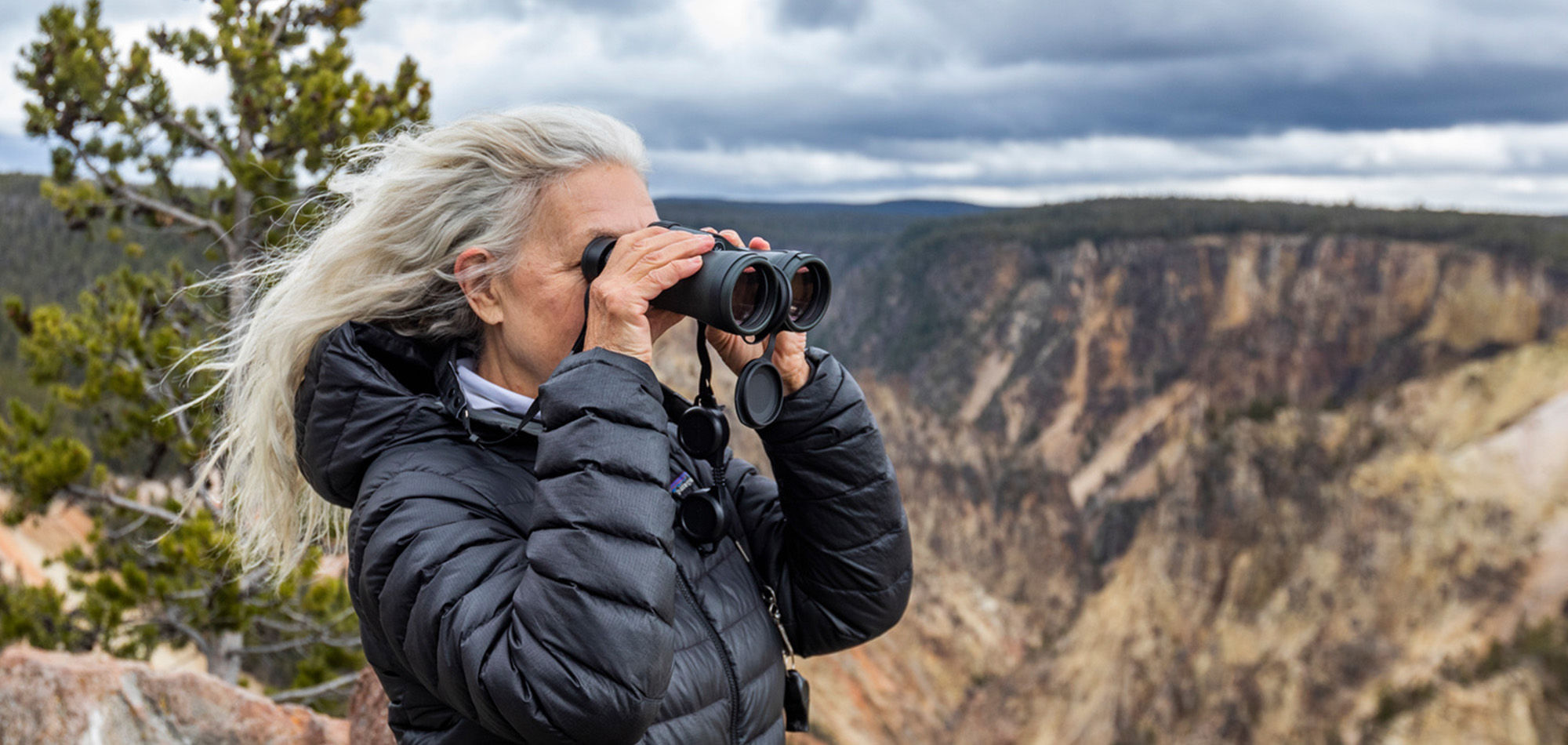 tourist looking through binoculars 